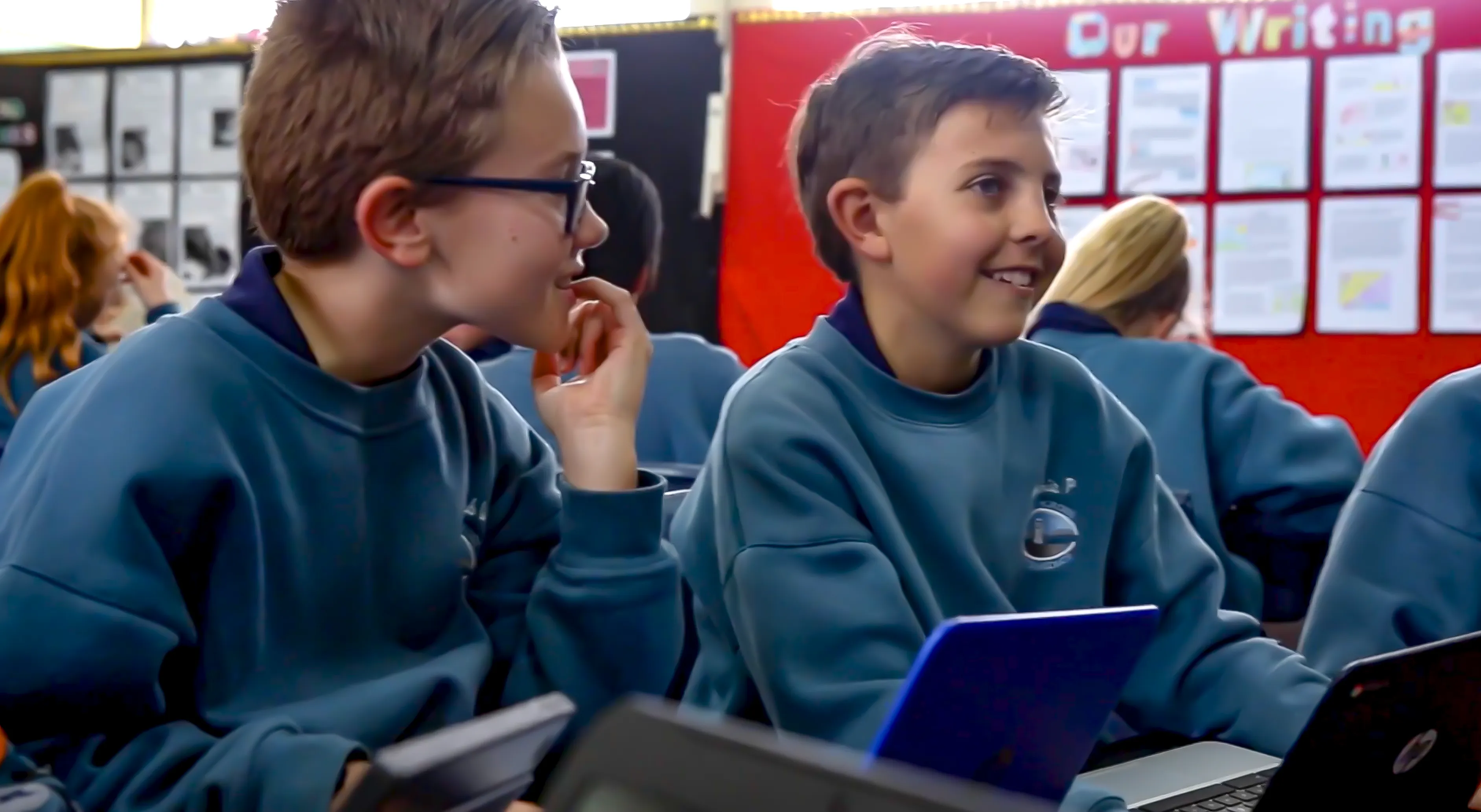 Smiling students at Northcross Intermediate using Writer's Toolbox